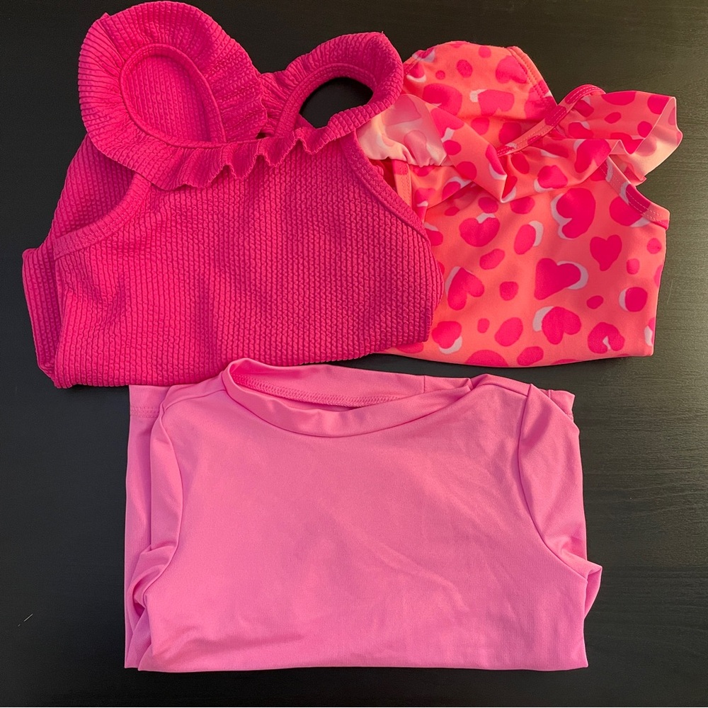 Two one piece pink 18 month swimsuit and one pink rashguard